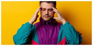 Style man in 90s tracksuit on yellow background, wondering how to get rid of a bad weed trip
