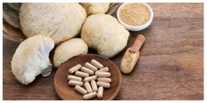 Lion’s Mane mushroom and supplement capsules on a wooden table — best lion's mane supplements for focus and natural brain health support