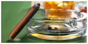 hemp wrap or a blunt on an ashtray on green table